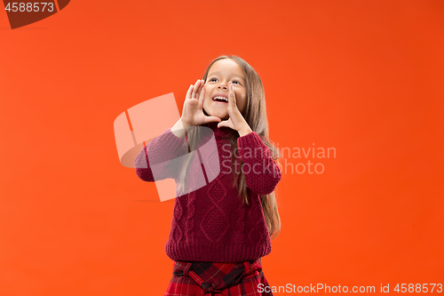 Image of Isolated on blue young casual teen girl shouting at studio