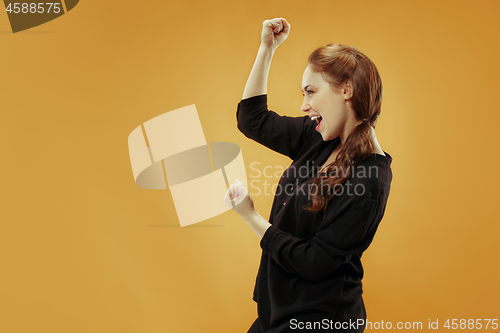 Image of Winning success woman happy ecstatic celebrating being a winner. Dynamic energetic image of female model