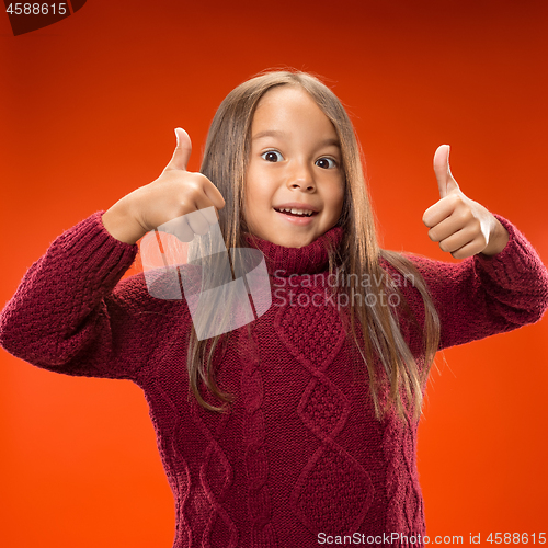 Image of The happy teen girl standing and smiling