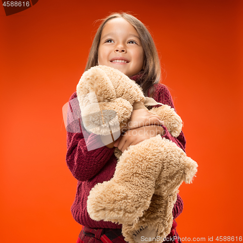 Image of The happy teen girl standing and smiling