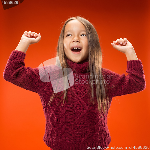 Image of The happy teen girl standing and smiling