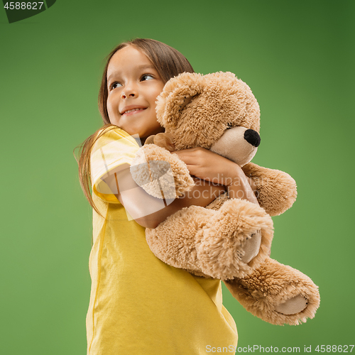 Image of The happy teen girl standing and smiling