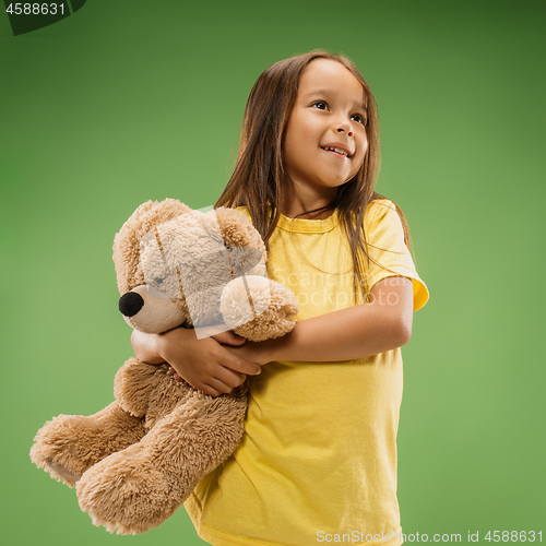 Image of The happy teen girl standing and smiling