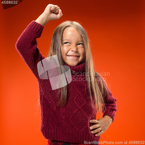 Image of Portrait of angry teen girl on studio background