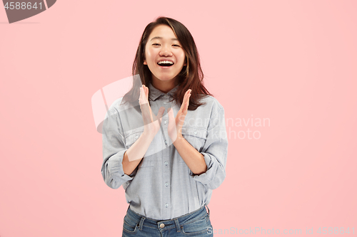 Image of Beautiful woman looking suprised isolated on pink