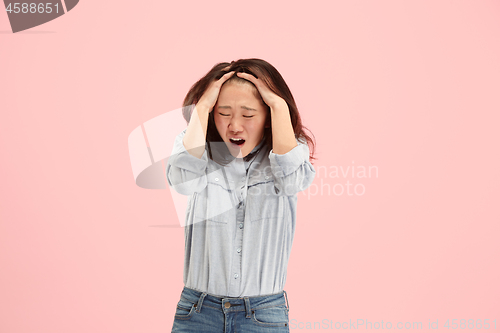 Image of Beautiful woman looking suprised and bewildered isolated on pink