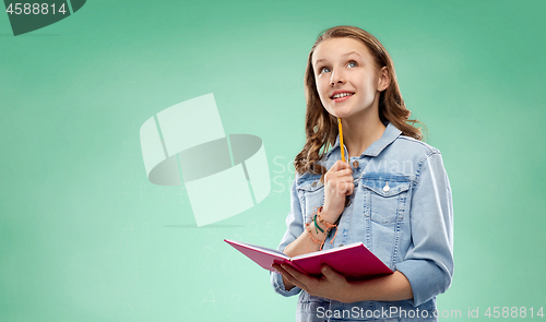 Image of student girl with notebook over green background