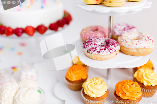 Image of food and drinks on table at birthday party