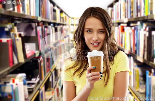 Image of teenage student girl drinking coffee at library