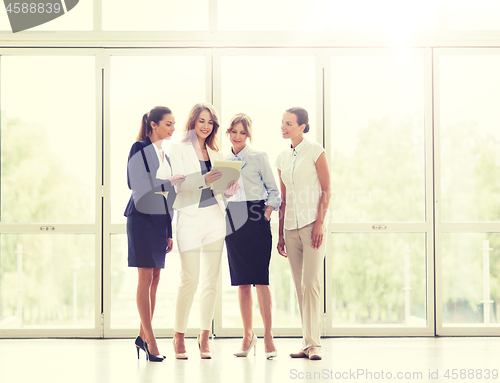 Image of business people with tablet pc computer at office