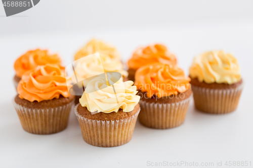 Image of cupcakes with frosting on white background