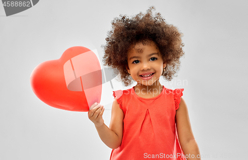 Image of african american girl with heart shaped balloon