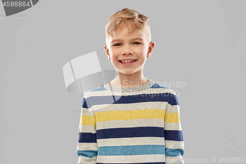 Image of portrait of smiling boy in striped pullover