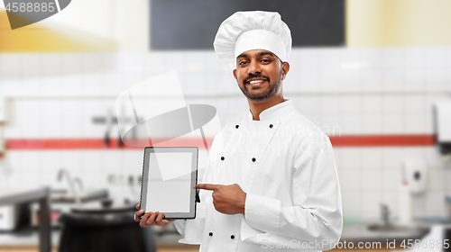 Image of indian chef with tablet pc at restaurant kitchen