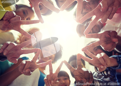 Image of international students showing peace or v sign