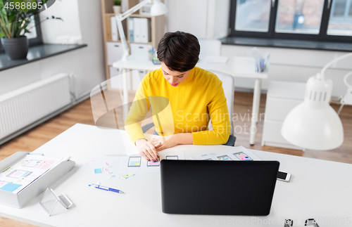 Image of ui designer working on user interface at office