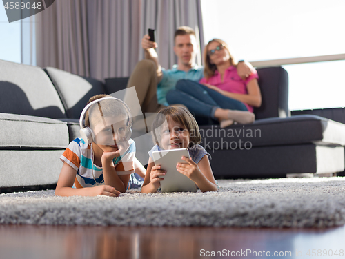 Image of couple spending time with kids