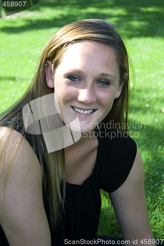 Image of Beautiful Girl in the Park in a Black Dress