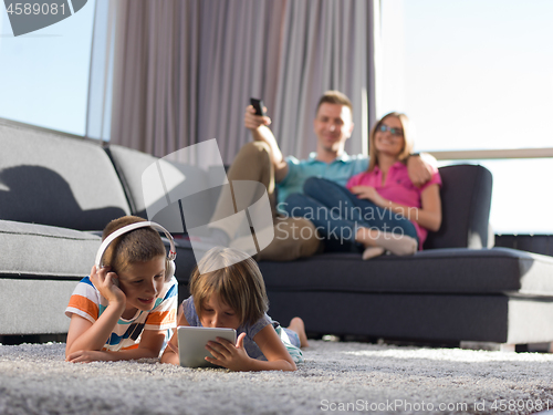 Image of couple spending time with kids