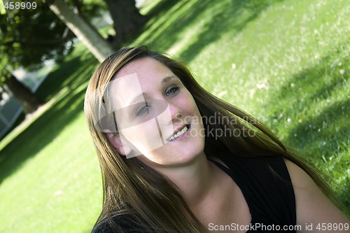 Image of Beautiful Girl in the Park in a Black Dress