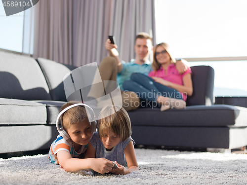 Image of couple spending time with kids