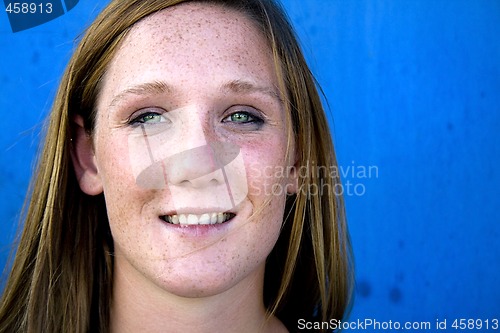 Image of Close up on a Beautiful Girl with Blue Background