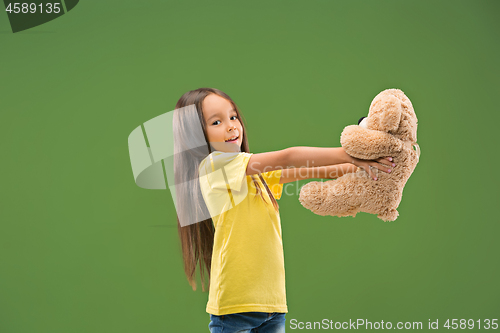 Image of The happy teen girl standing and smiling