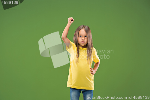 Image of Portrait of angry teen girl on studio background