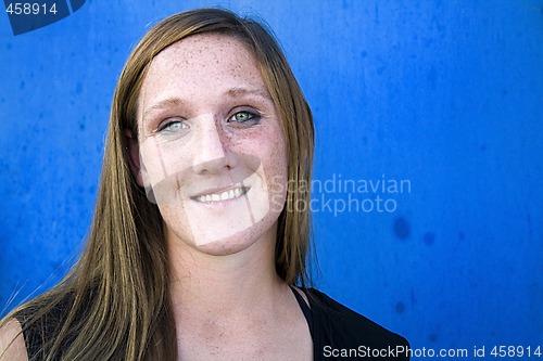 Image of Close up on a Beautiful Girl with Blue Background