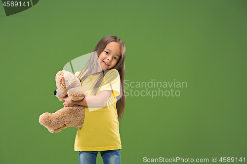 Image of The happy teen girl standing and smiling