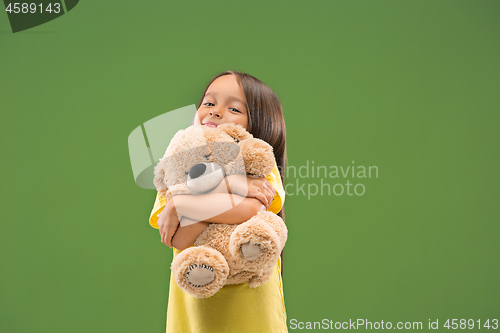 Image of The happy teen girl standing and smiling