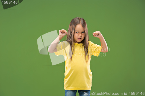 Image of Portrait of angry teen girl on studio background