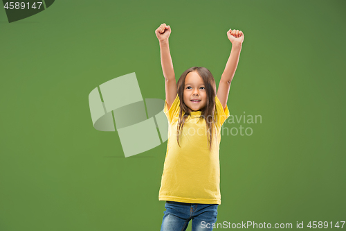 Image of The happy teen girl standing and smiling