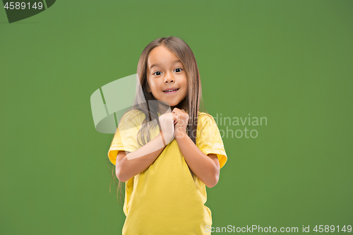 Image of The happy teen girl standing and smiling