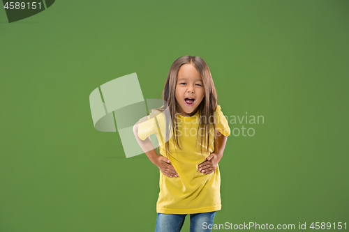 Image of The happy teen girl standing and smiling