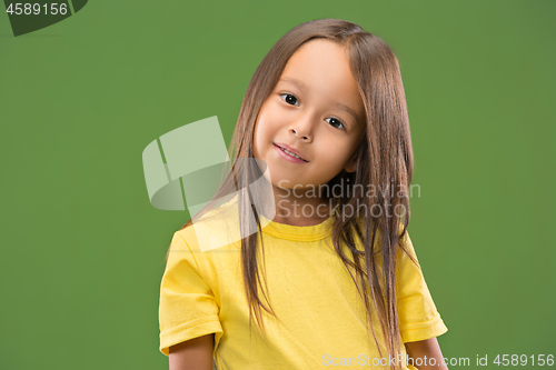 Image of The happy teen girl standing and smiling