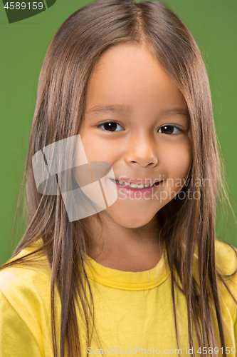 Image of The happy teen girl standing and smiling