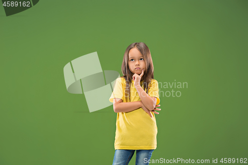 Image of Young serious thoughtful teen girl. Doubt concept.