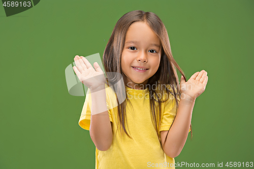 Image of The happy teen girl standing and smiling