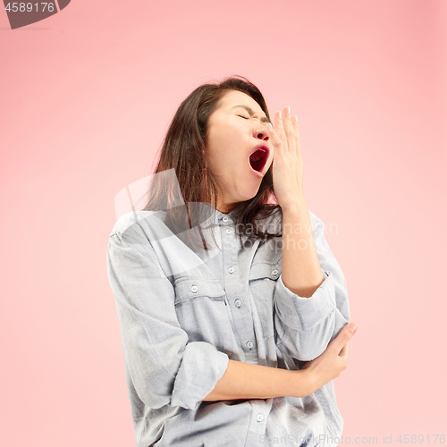 Image of Beautiful bored woman bored isolated on pink background