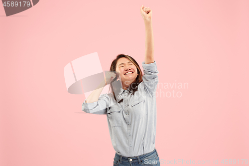 Image of Winning success woman happy ecstatic celebrating being a winner. Dynamic energetic image of female model