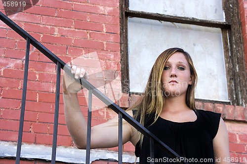 Image of Beautiful Girl posing outdoors on stairs in the City