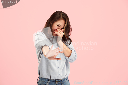 Image of Let me think. Doubtful pensive woman with thoughtful expression making choice against pink background