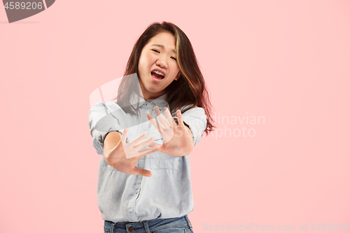 Image of Let me think. Doubtful pensive woman with thoughtful expression making choice against pink background