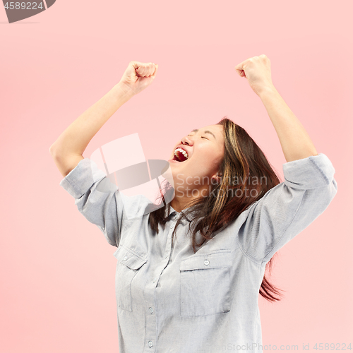 Image of Winning success woman happy ecstatic celebrating being a winner. Dynamic energetic image of female model