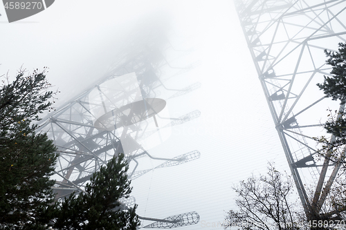 Image of Large antenna complex in the mist