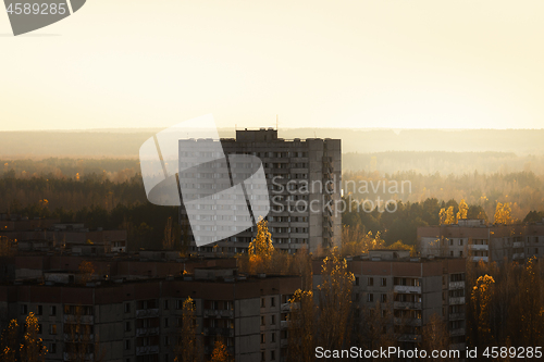 Image of Large abandoned old apartment in the sunset