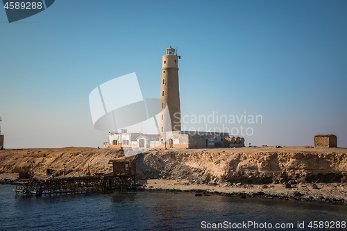 Image of Tall lighthouse on the sea