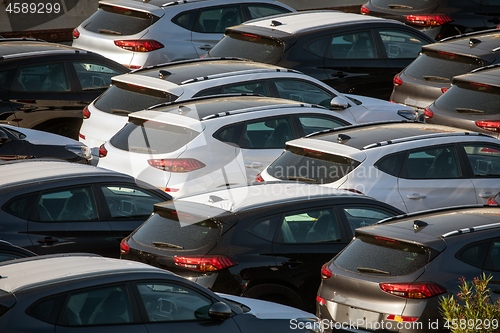 Image of Lot of cars being transported to trade location