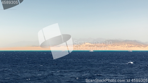 Image of Land over the horizon with mountains